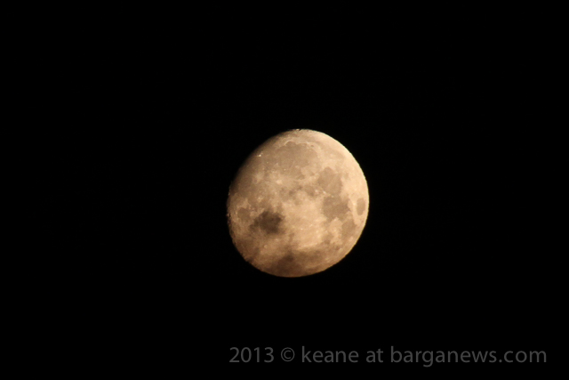 Clouds obscure moon setting through Monte Forato